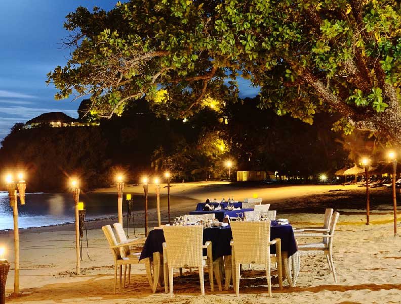Beach and resort at Andilana deluxe hotel in Nosy Be